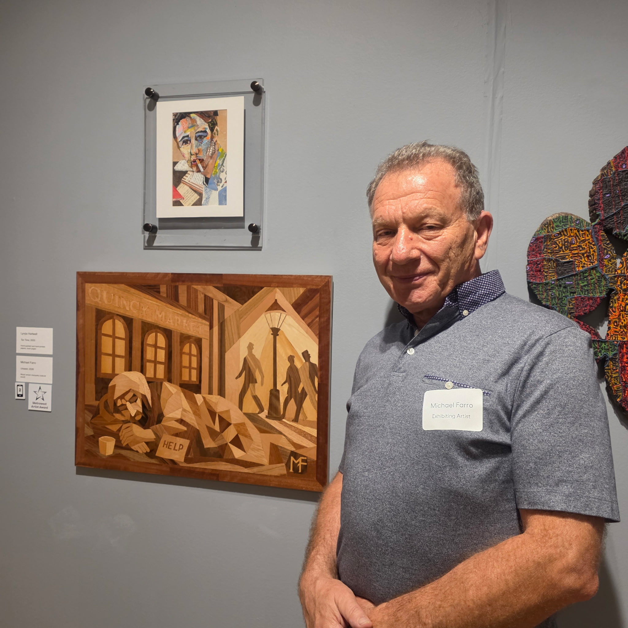Michael Farro standing beside Unseen at the Danforth Annual Juried Exhibition